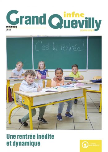 couverture du Grand Quevilly de septembre 2023, des enfants souriants assis dans une salle de classe